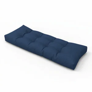 Long custom navy blue tufted wicker bench cushion with a classic buttonless dimple design