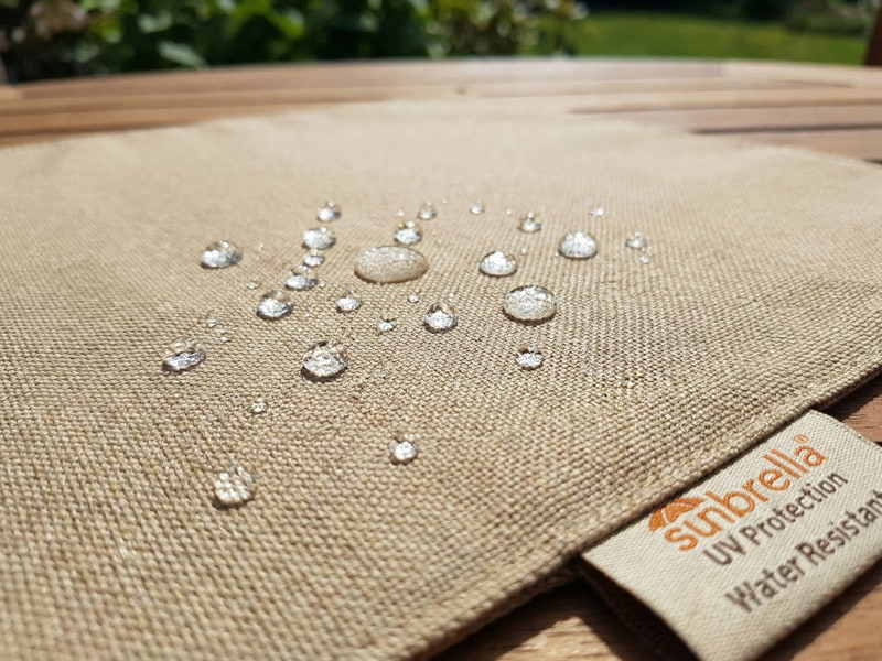 Sunbrella outdoor fabric showing water beading up on surface and UV protection details